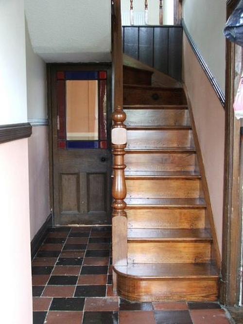 Original features abound with clay tiles, gorgeous pine staircase and even an original stained-glass