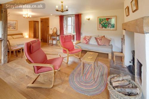 The living area with two easy chairs and a sofa bed