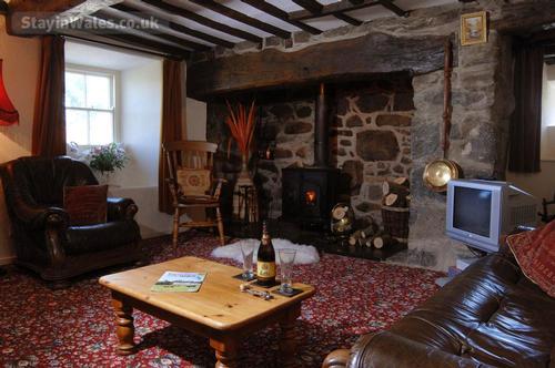 Olde worlde charm of the 16th century lounge with original beams and massive inglenook fireplace at 