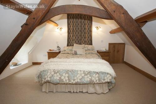 Beamed bedroom at Betws Bach Farmhouse