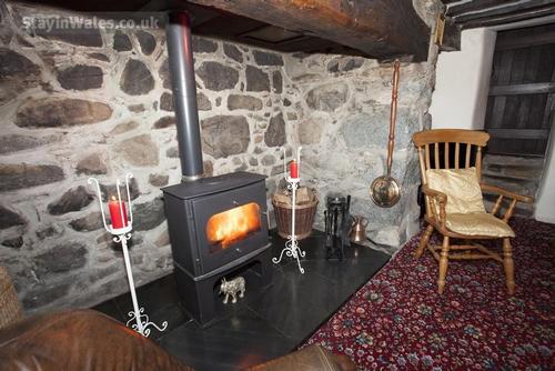 Relax by the fire with a good book and a glass of wine