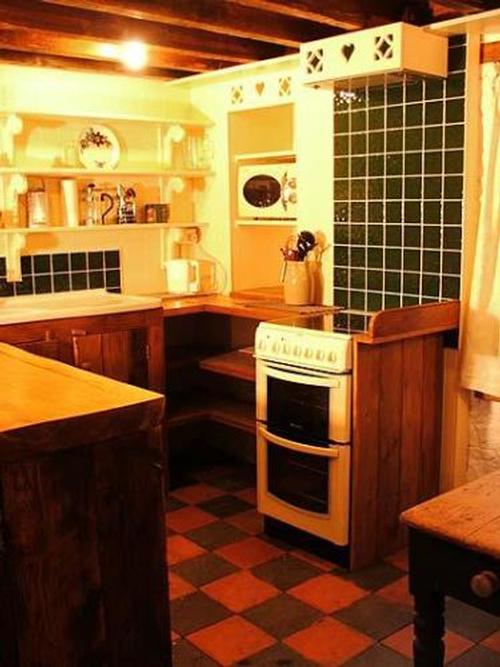 The well equipped handmade oak kitchen is a pleasure to cook in