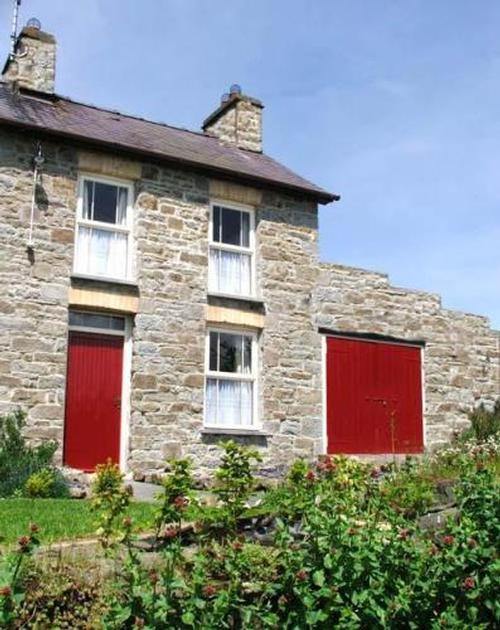 The cottage''s stone walls are 2 feet wide