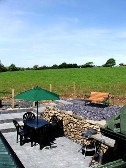 The patio is private and well equipped, with dining table, chairs, loungers, barbecue and lovely vie