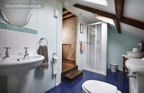 The en-suite shower room is full of character too