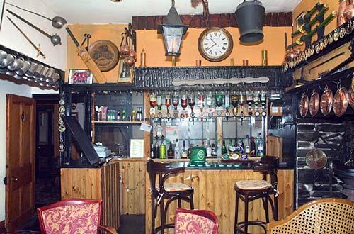 The olde worlde bar with log-burning stove