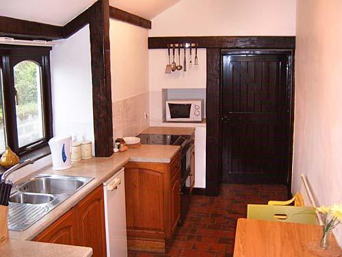 The galley kitchen - looks out across the rear patio