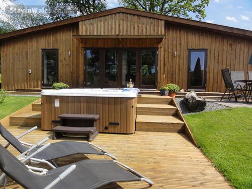 Ash Lodge with private hot tub decked veranda.