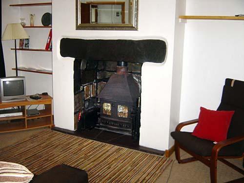 The living room has a log burner
