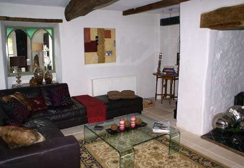 The living room with inglenook fireplace