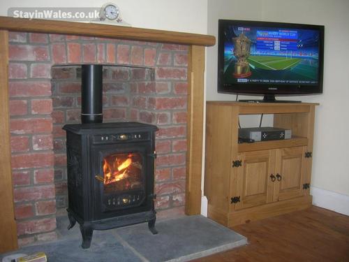 Log burner and flat screen TV in the lounge