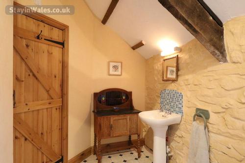 The bathroom with original exposed beams