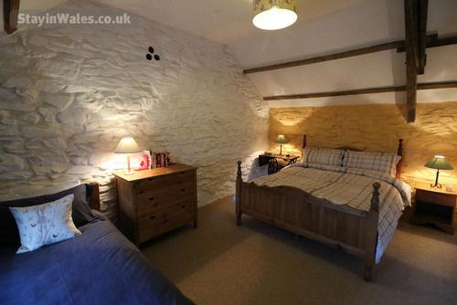 The main bedroom with king-size and single bed