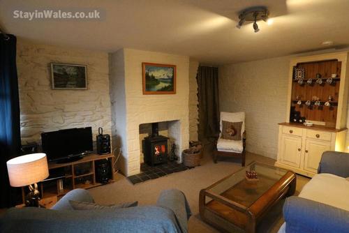 The cosy lounge with log burner