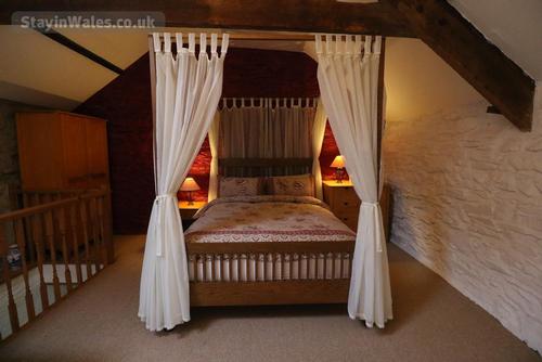 The bedroom - the four-poster king-size bed