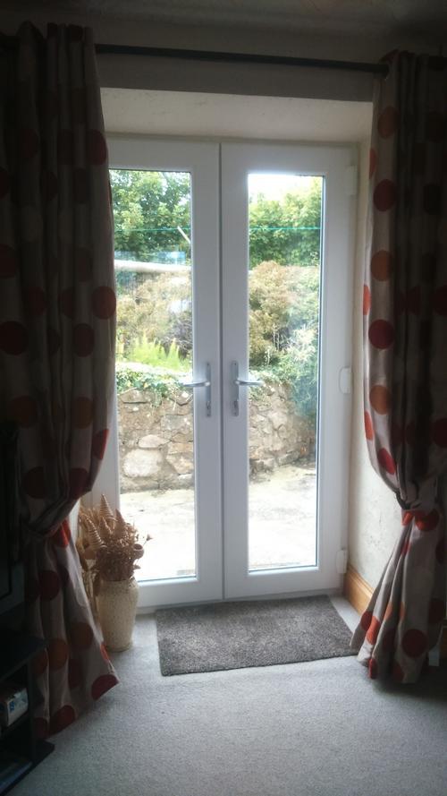 Double french windows from front lounge to fully enclosed private rear garden