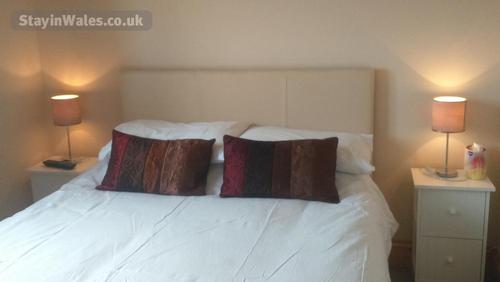 Bedroom 5- double bedroom with flatscreen TV on wall