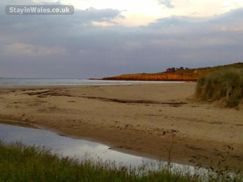 Sunset at Lligwy Beach and Lligwy river with the sand dunes on the right