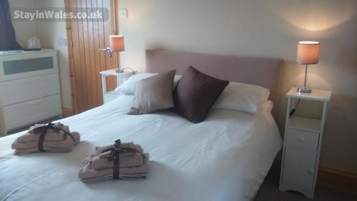 First floor double ensuite with TV (bedroom 4) - with room for cot / travel cot