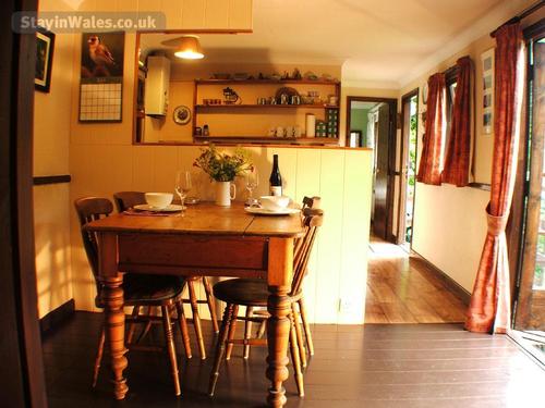 Enjoy a relxed meal in the pretty dining room with stunning views