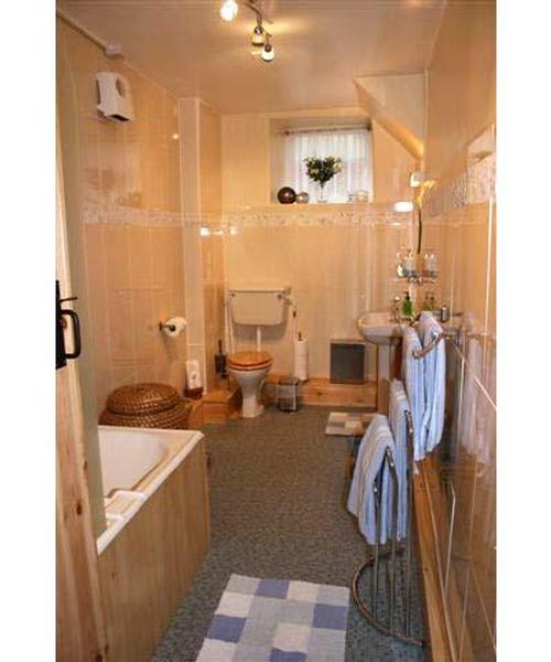 Upstairs bathroom with shower over bath.