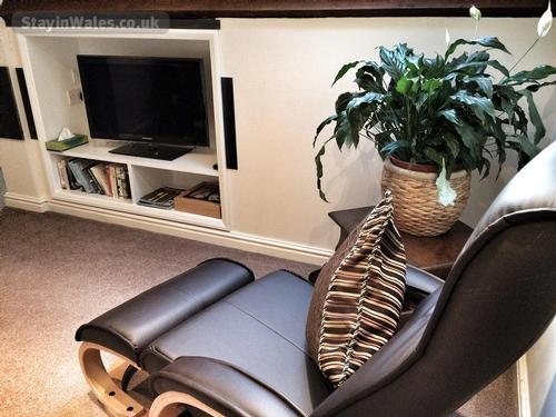Recliner with LED flat screen TV.
