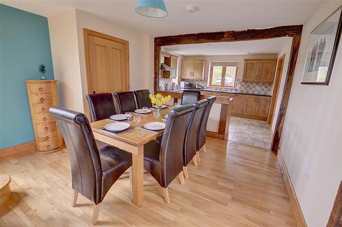 The dining area is adjacent to the kitchen