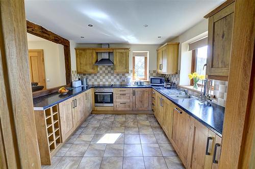 The kitchen - large airy and spacious. Lovely views from each window.