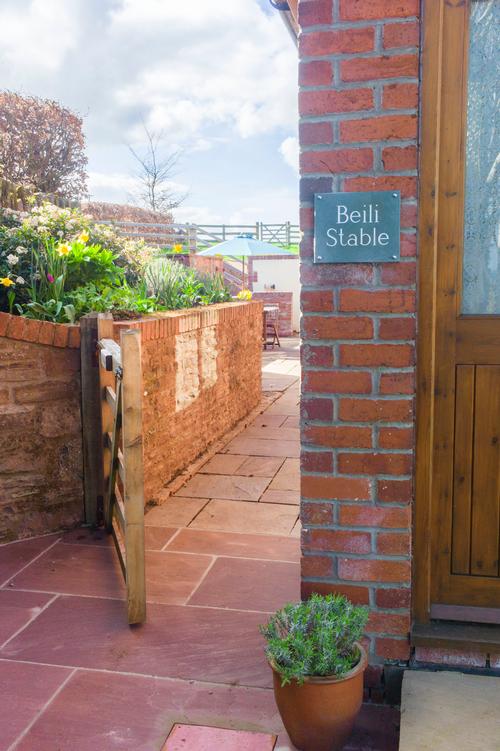 Front door and gate to private patio