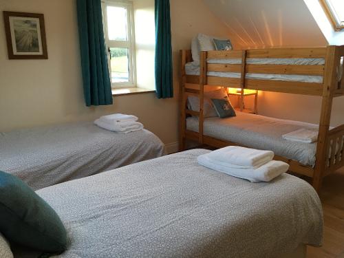 Bedroom 4. Upstairs bedroom sleeps 4 with twin or double bed and bunk bed