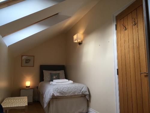 Bedroom 2. Upstairs bedroom sleeps 2 with two single beds either end of room