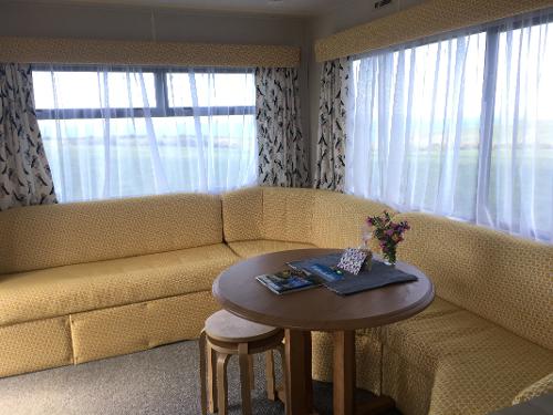 Seating area with large windows to the sea view
