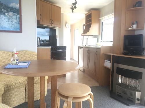 Dining/kitchen area with gas fire