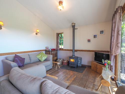 View of your sitting room with a lovely woodburning stove