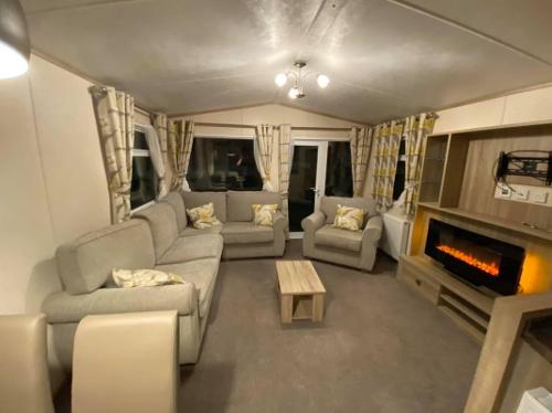 Spacious lounge area with panoramic back lit fire